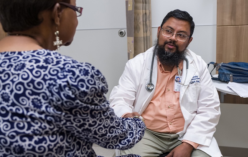 Dr. Suhaib Haq speaks with a patient.