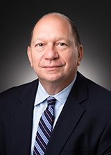 headshot of Ed Banos