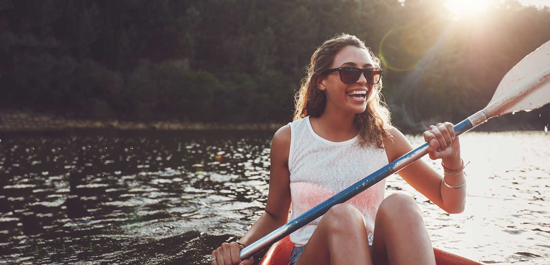 Woman smiling while kayaking