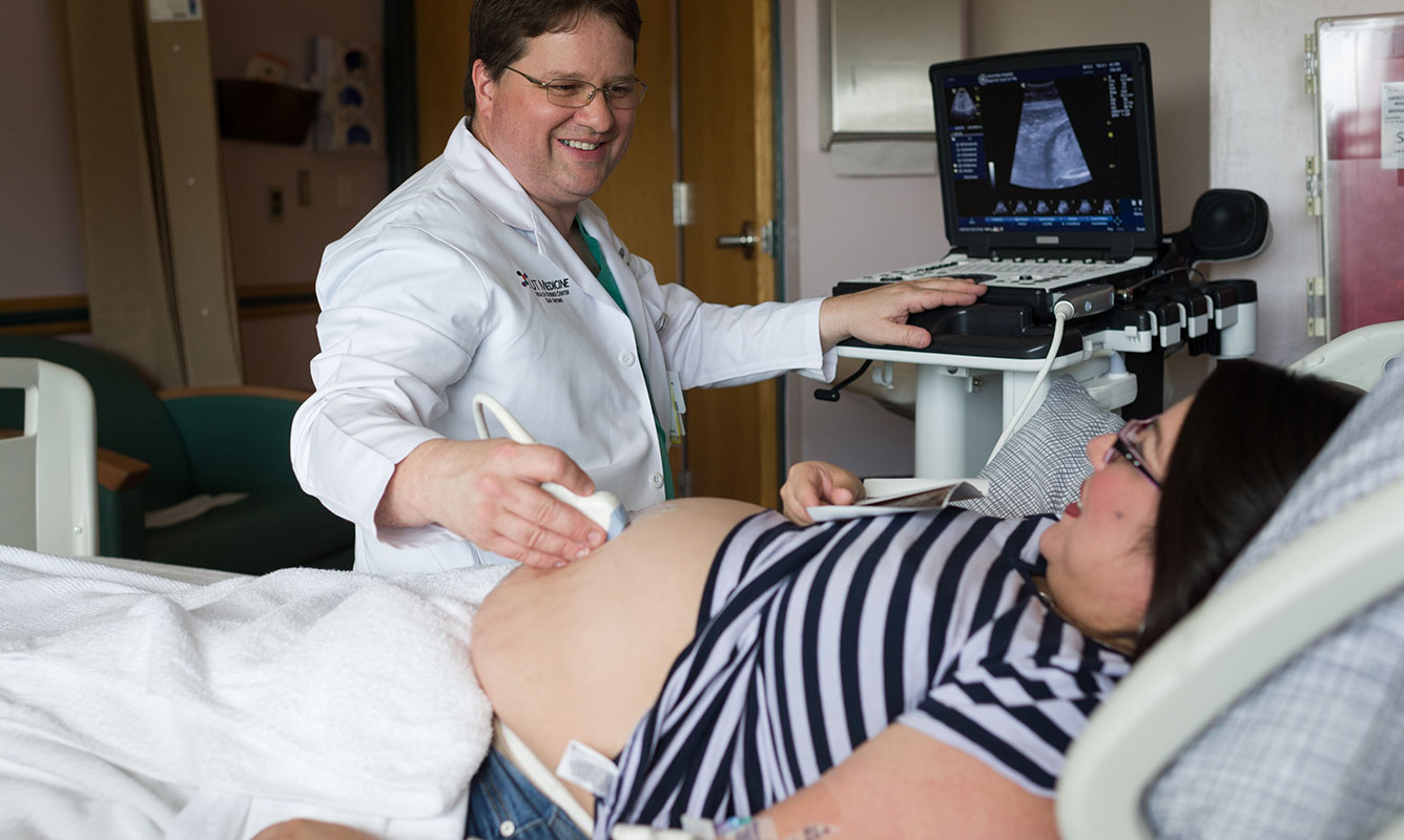 Dr. Patrick Ramsey, high-risk pregnancy doctor giving patient an ultrasound