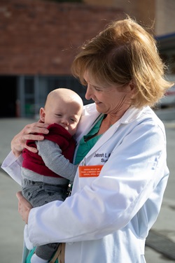 Dr. McCroy holding baby Ethan