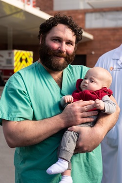 Dr. Bittenbinder holding baby Ethan