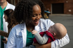 Dr. McCroy holding baby Ethan