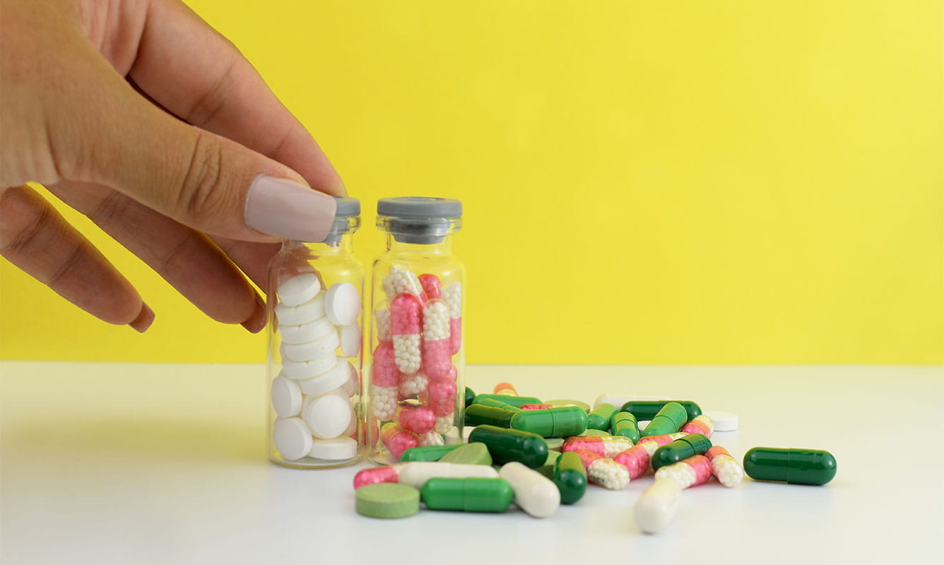 Woman takes daily medicine