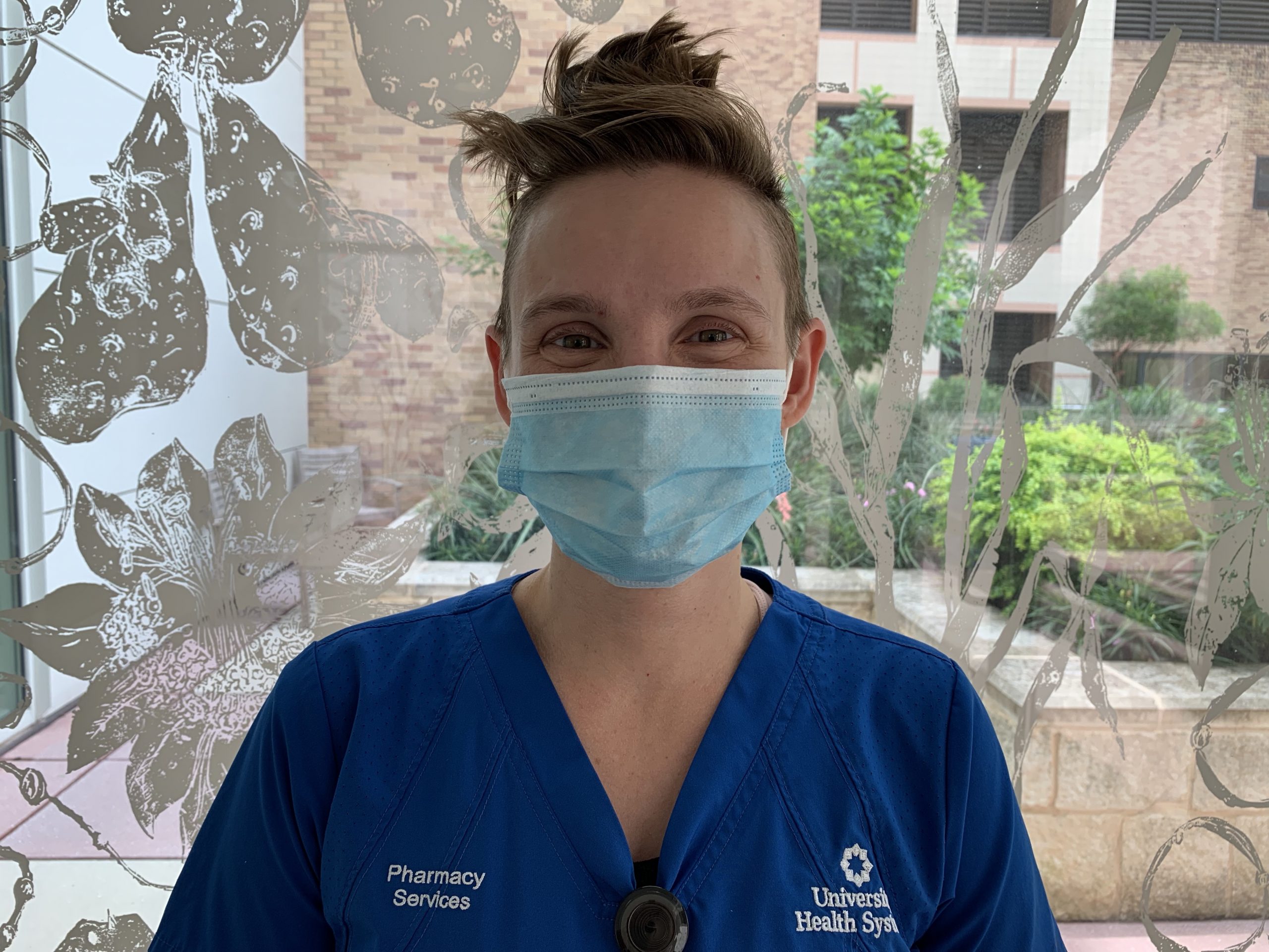 a female healthcare worker wears a mask