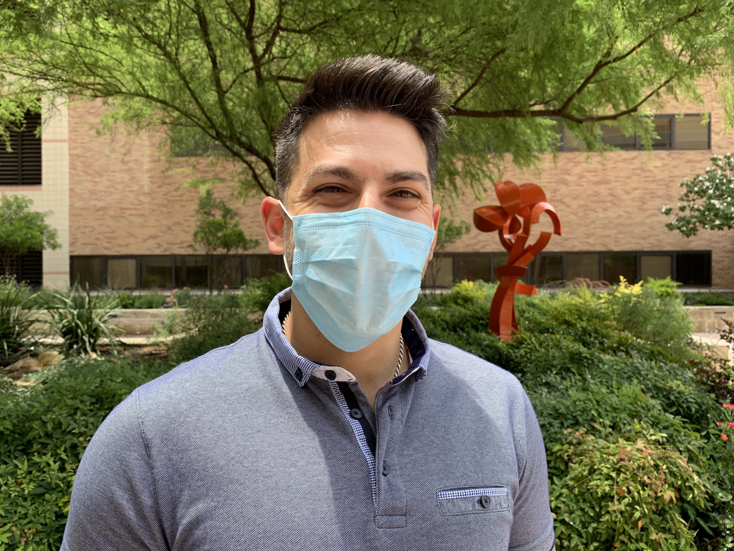 a male healthcare worker wearing a mask