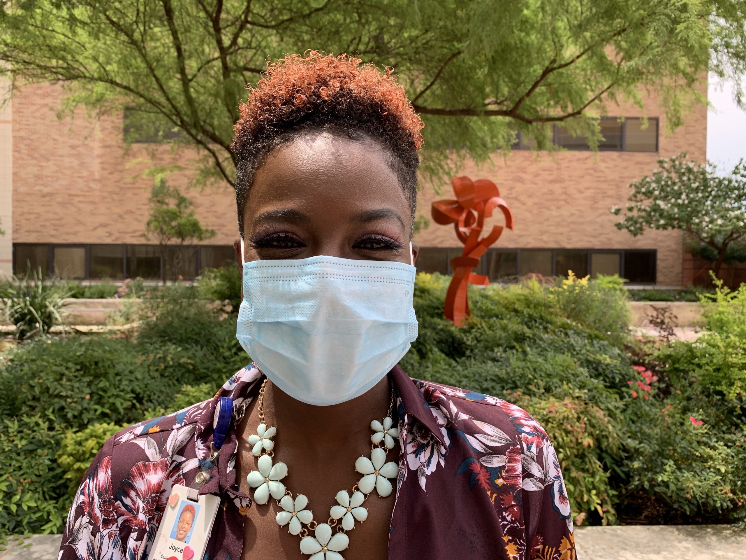 a female healthcare worker wears a mask