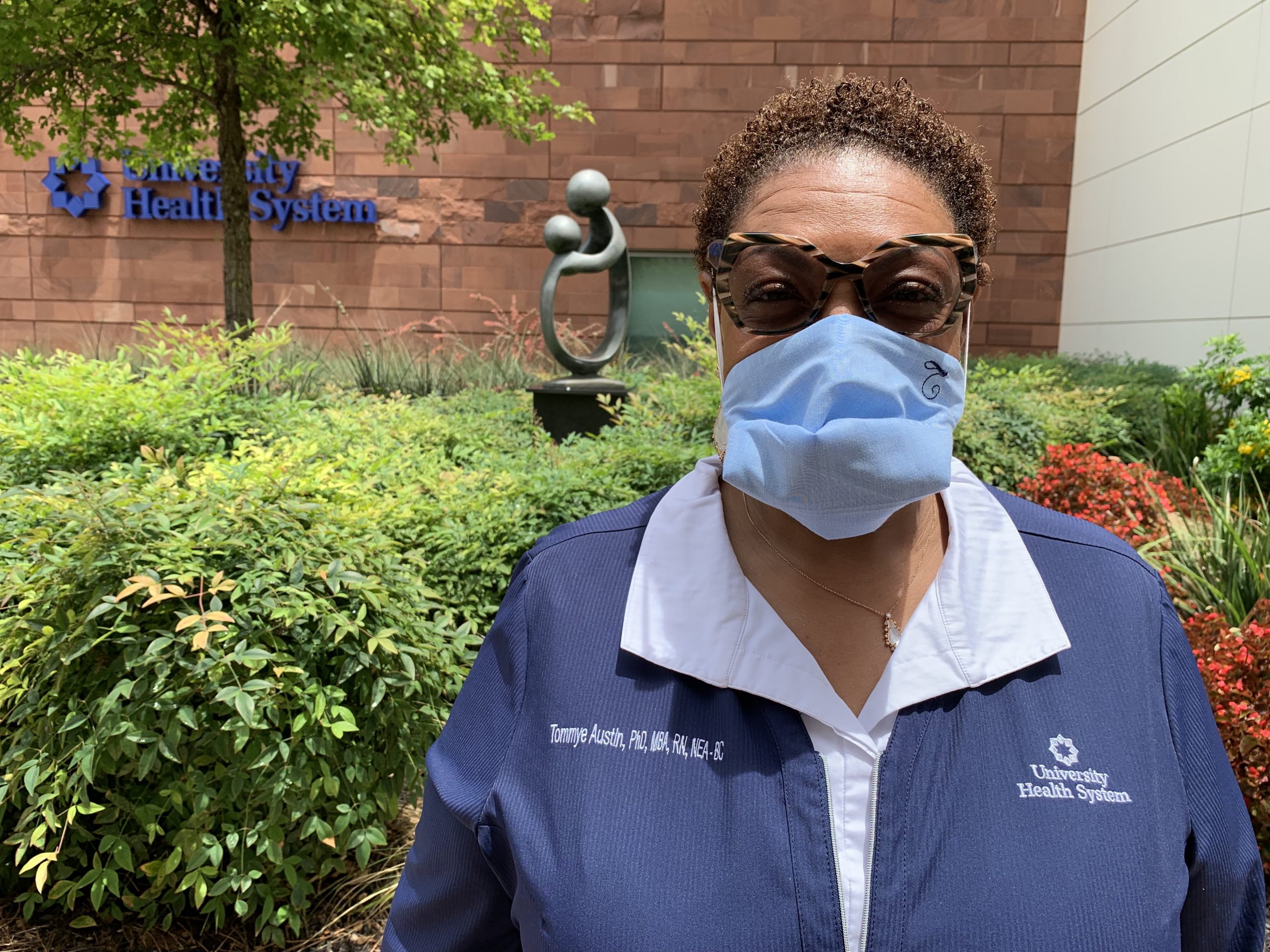 female nurse wearing a mask