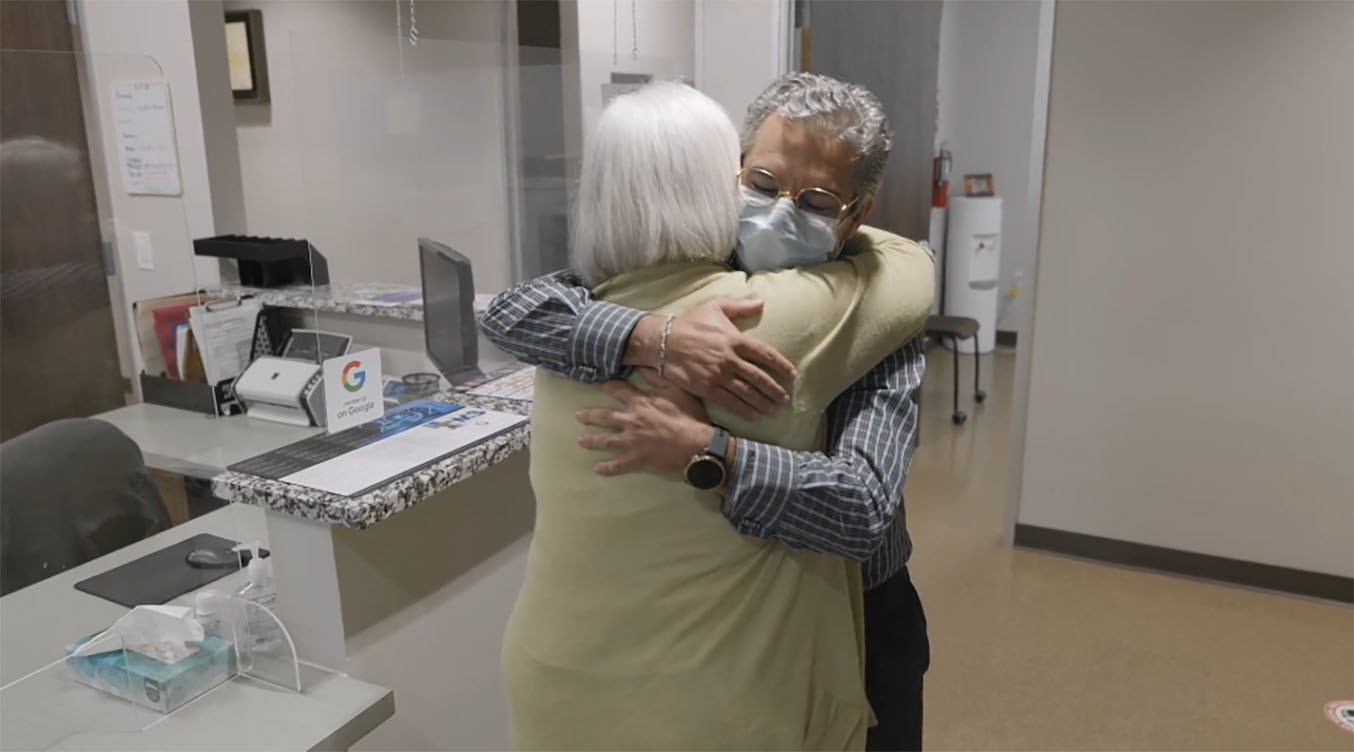Dr. Marc Chalaby and Serena Irons hug after liver transplant surgery.