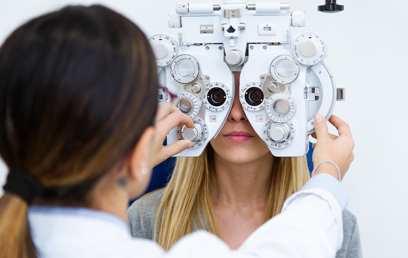 A woman gets an eye exam.