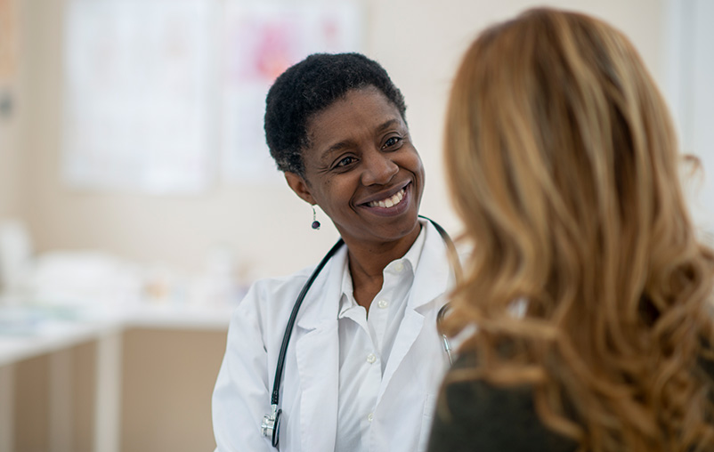 A female provider speaks with a patient.