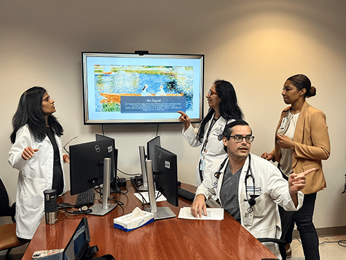 University Health Cardio-Kidney-Metabolic Clinic team meeting over a topic. 