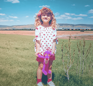 University Health patient, Malea Potter in a field.
