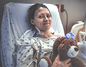 University Health patient, Malea Potter in a hospital bed. 
