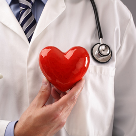 health care provider holding a heart