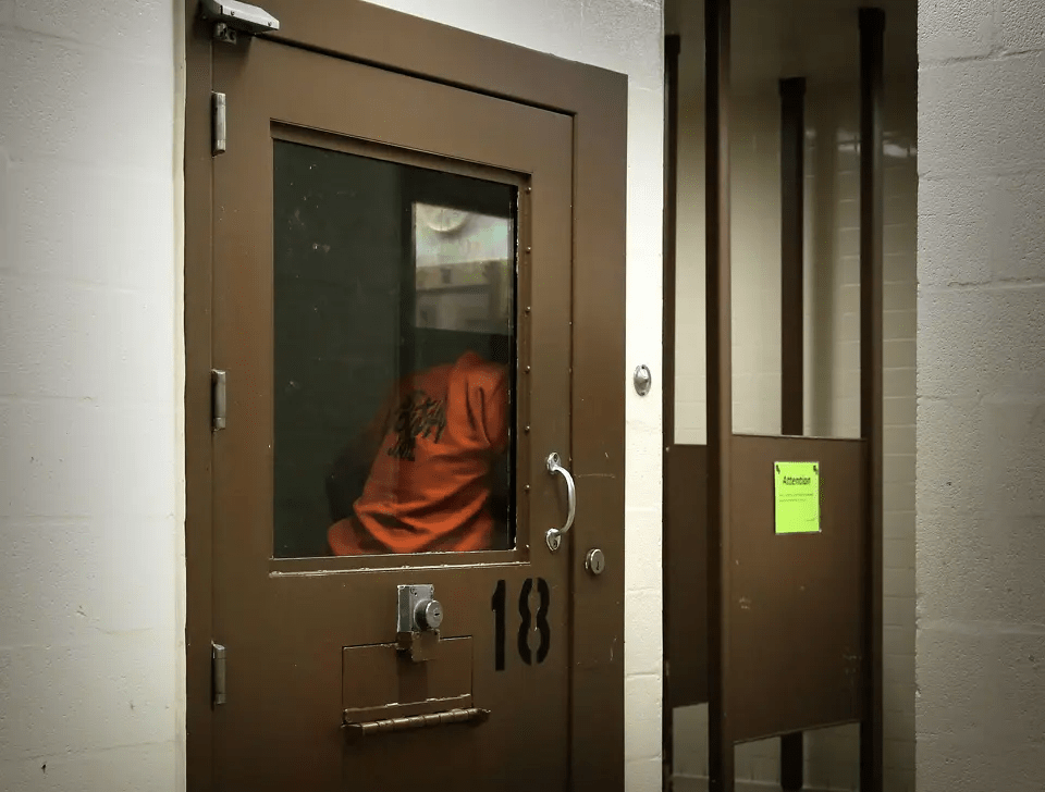 An inmate languishes in his cell in Bexar County Adult Detention Center mental health unit. The best way to reduce deaths at the jail is to improve treatment in the community.