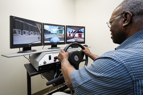Man using driving assessment device