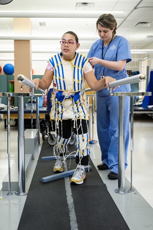 Girl using Therasuit therapy