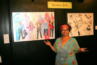Artist Barbara Felix standing in front of her art.