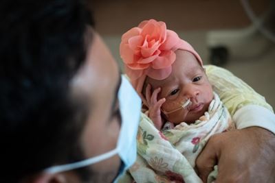 Picture of a parent holding a child.