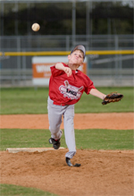 Drew Rice pitching a baseball on the diamond.