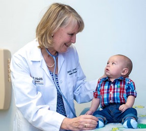 Dr.  Jane Lynch with a pediatric patient 