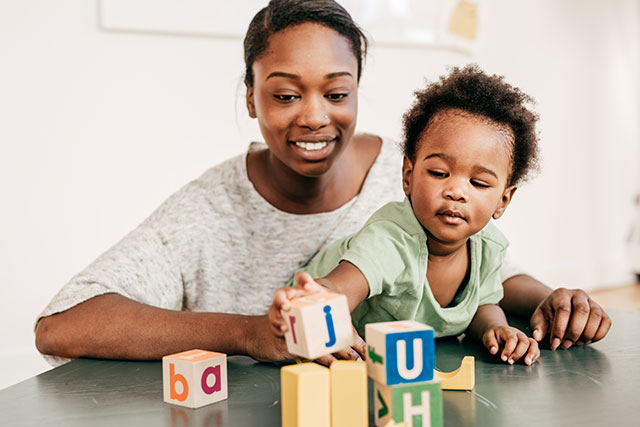 Woman playing with child