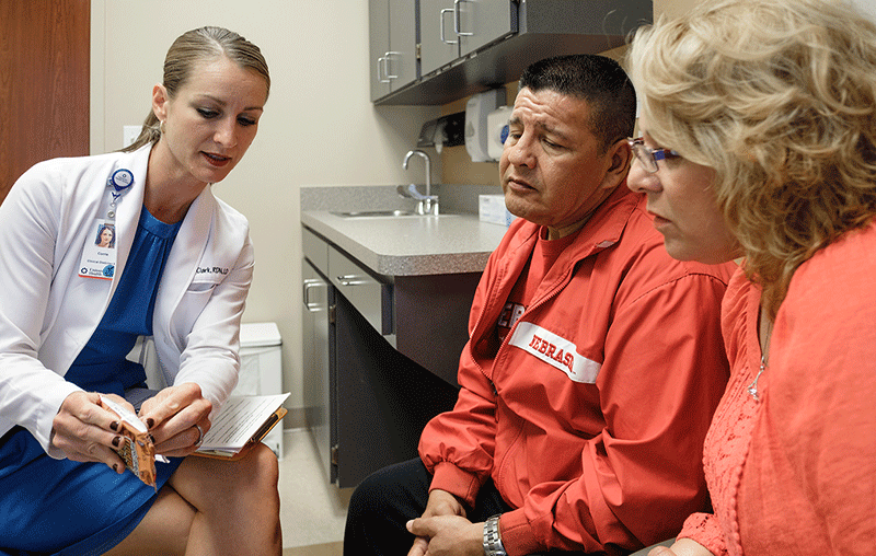 University Health dietician meeting with hepatology patient about food choices. 