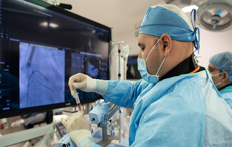 Interventional Cardiologist Ahmed Almomani, M.D. and his team perform a mitral clip trans-catheter procedure in one of the hybrid cath labs in the Advanced Diagnostic Center at University Hospital.